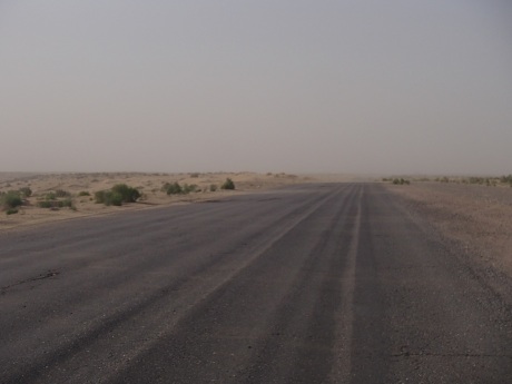 Sand blowing across the road in Turkmenistan before turning into a full on sandstorm.