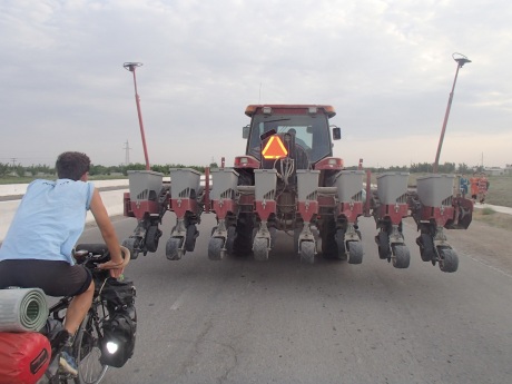 Chasing the tractor on the road to Bukhara, Uzbekistan.